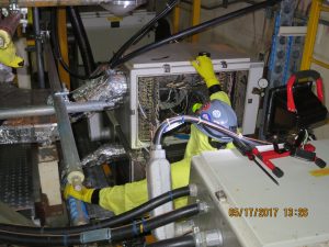 An Electricians Work electrician works to replace an original early 80’s vintage seismic monitoring system with a state-of-the-art industry system.